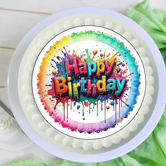 Runder, bunter essbarer Tortenaufleger (ca. 20 cm) mit großem "Happy Birthday"-Schriftzug in Regenbogenfarben und Farbspritzern  weißer Hintergrund – bereits ausgeschnitten.