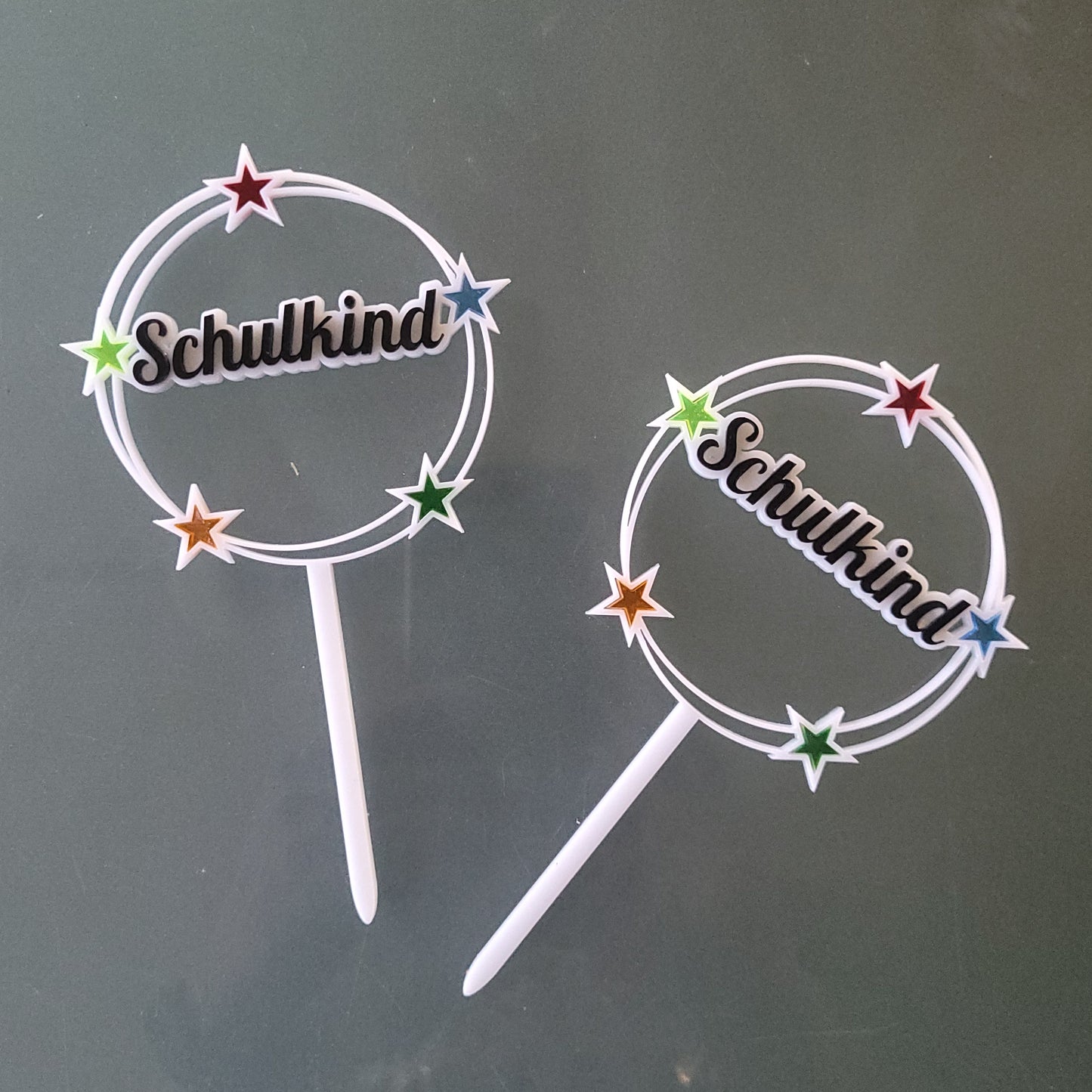 Tortenstecker Schulkind mit bunten Sternen