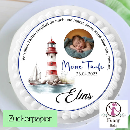 White frosted baptism cake with edible topper of baby Elias, lighthouse illustration, and date 23.04.2023.